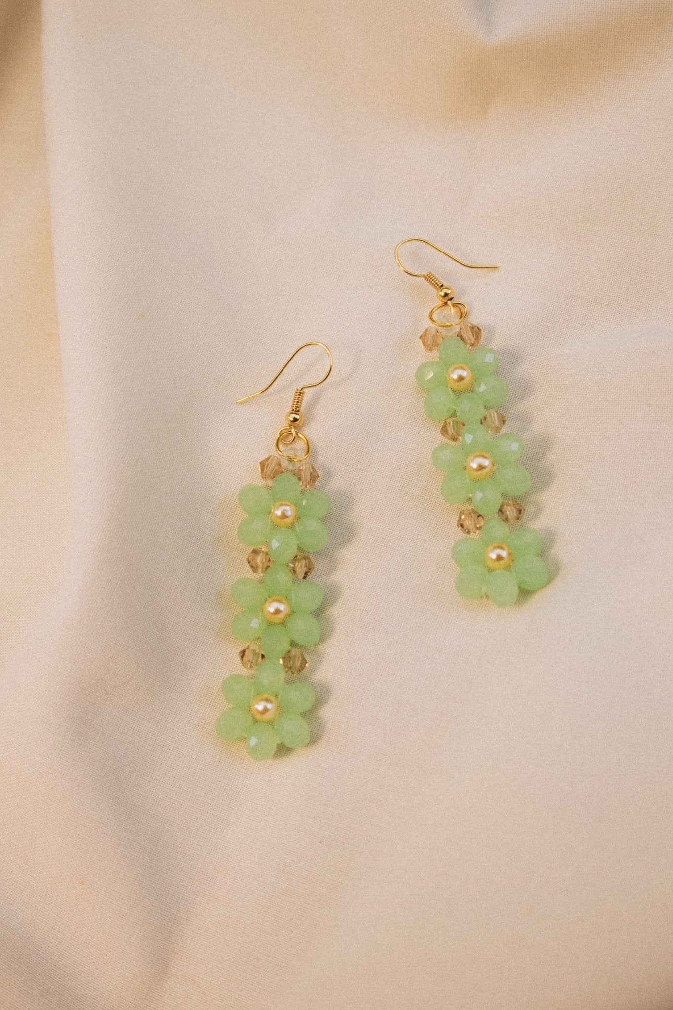 Handmade pistachio green beaded flower earrings with faux pearl centre – silver finish