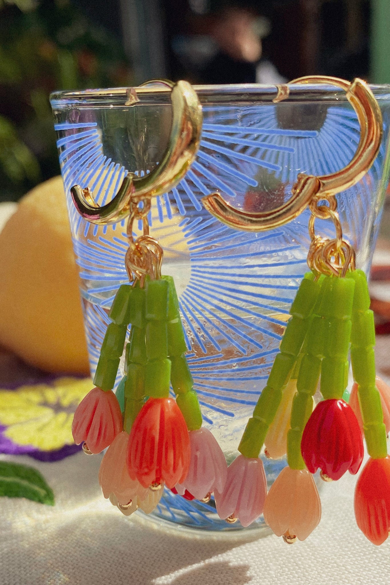 Asymmetric floral charm mini hoop earrings with colourful beads