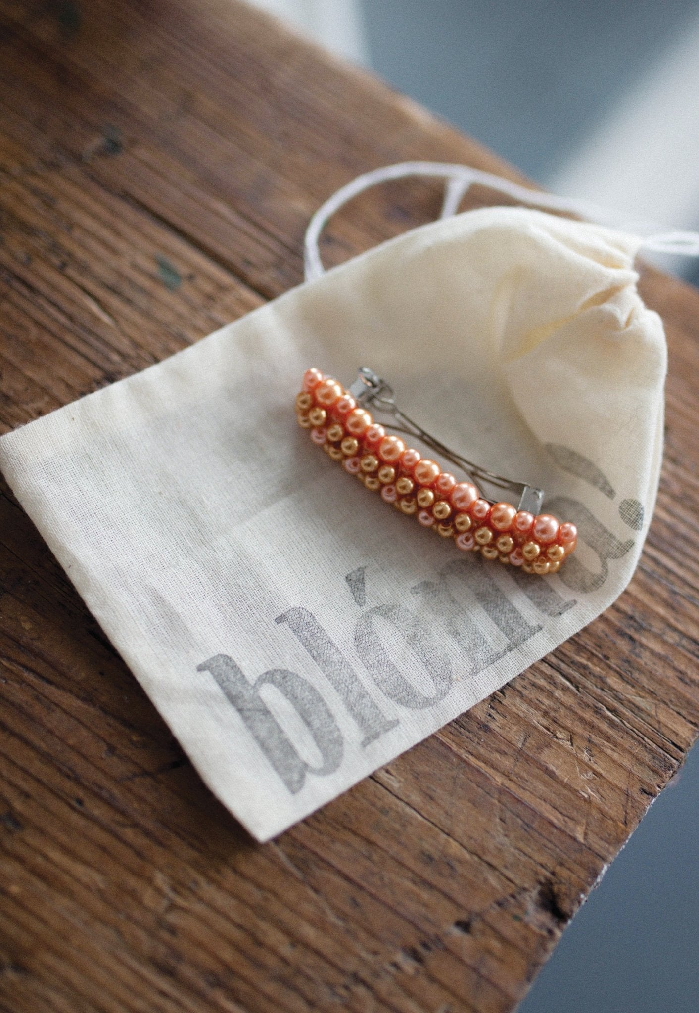 Close-up of Queenie Barrette showing glass pearl beaded design