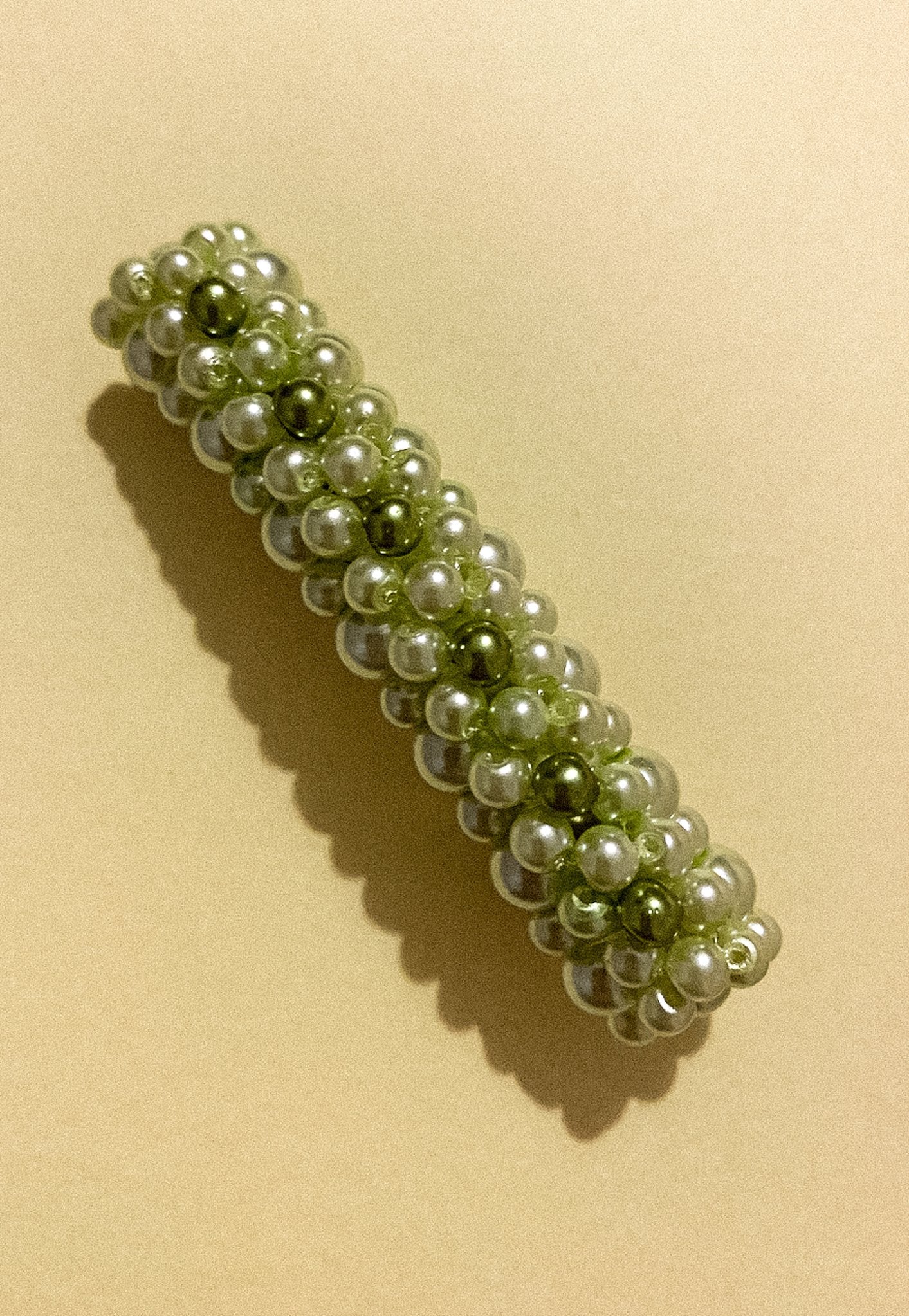 Close-up of Queenie Barrette showing glass pearl beaded design