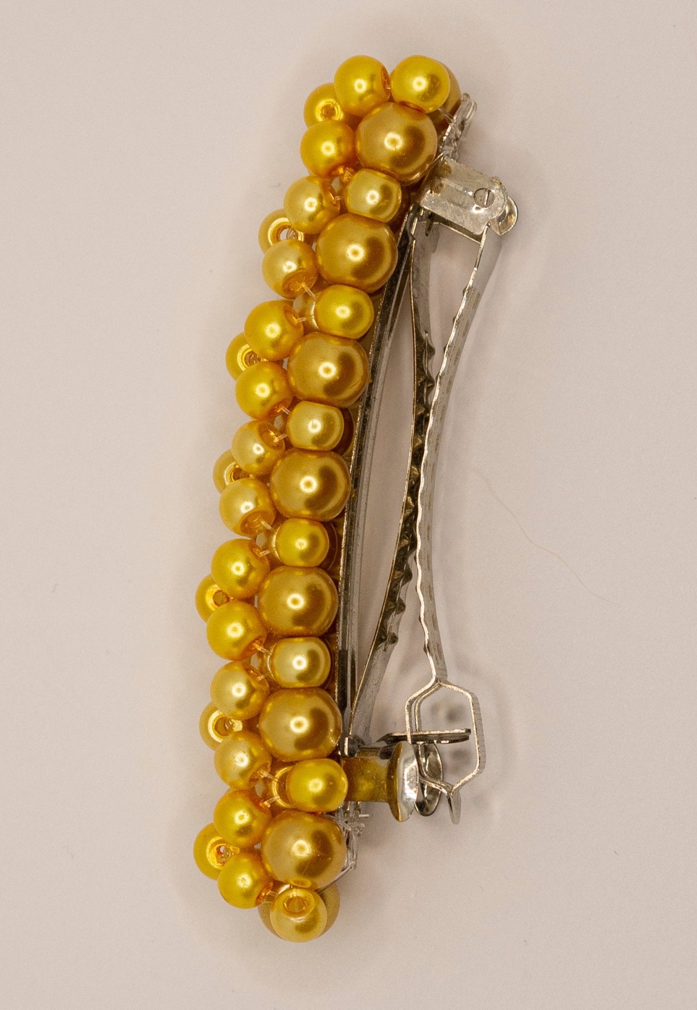 Close-up of Queenie Barrette showing glass pearl beaded design