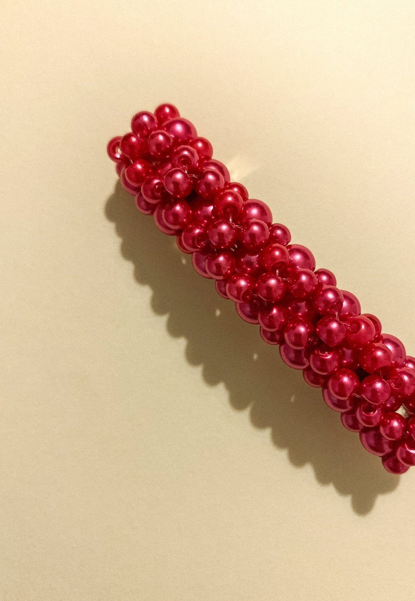 Close-up of Queenie Barrette showing glass pearl beaded design